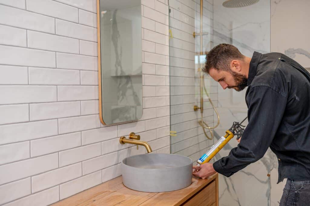 Bendigo builder sealing a bathroom sink