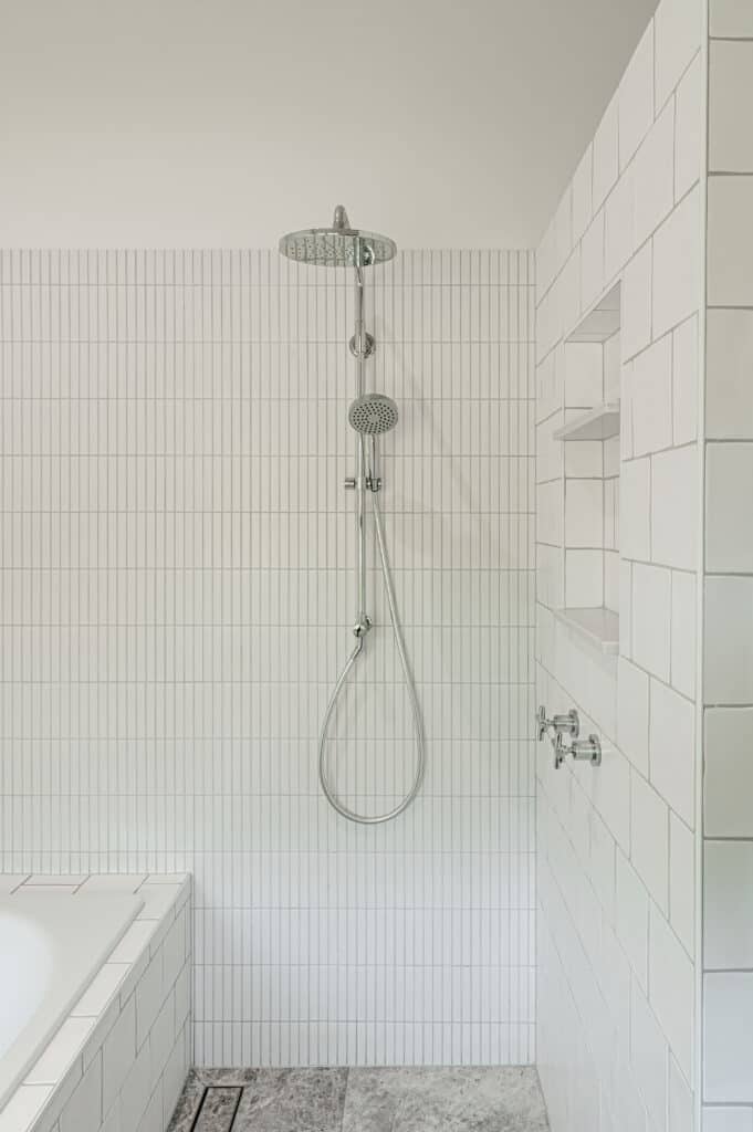 shower with white tiles