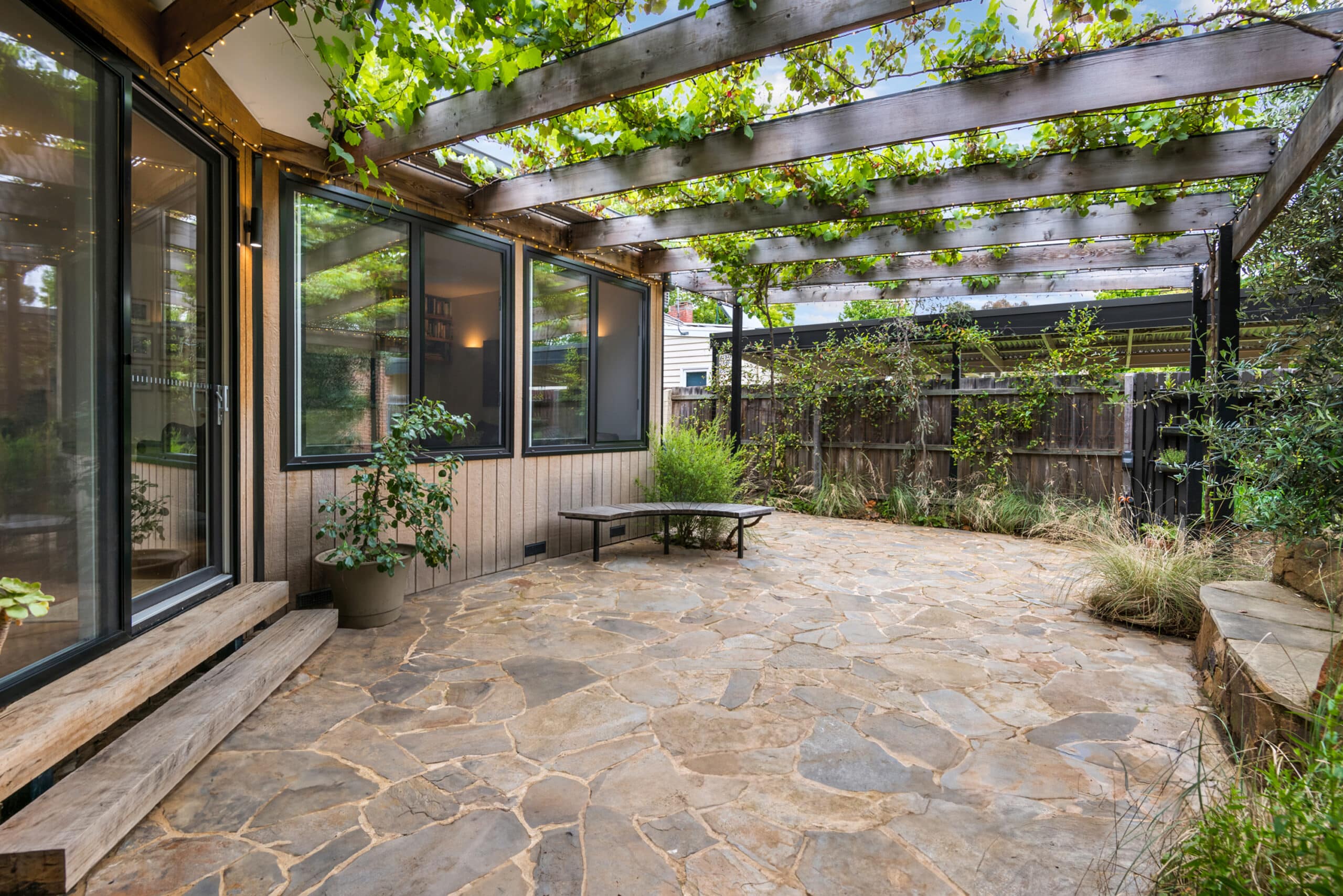 Outside area with stone floor and greenery