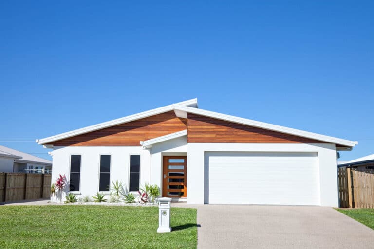 Front view of a new neat modern white house