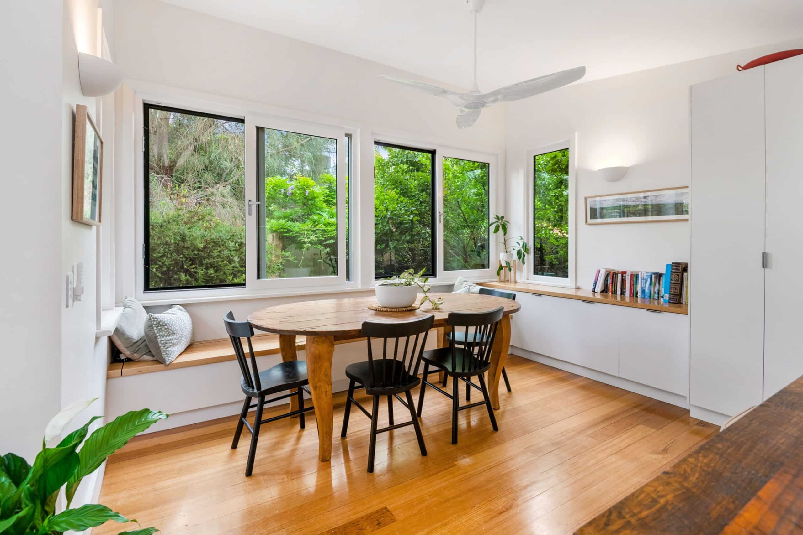 Clean and bright activity room with wooden floor and furnitures
